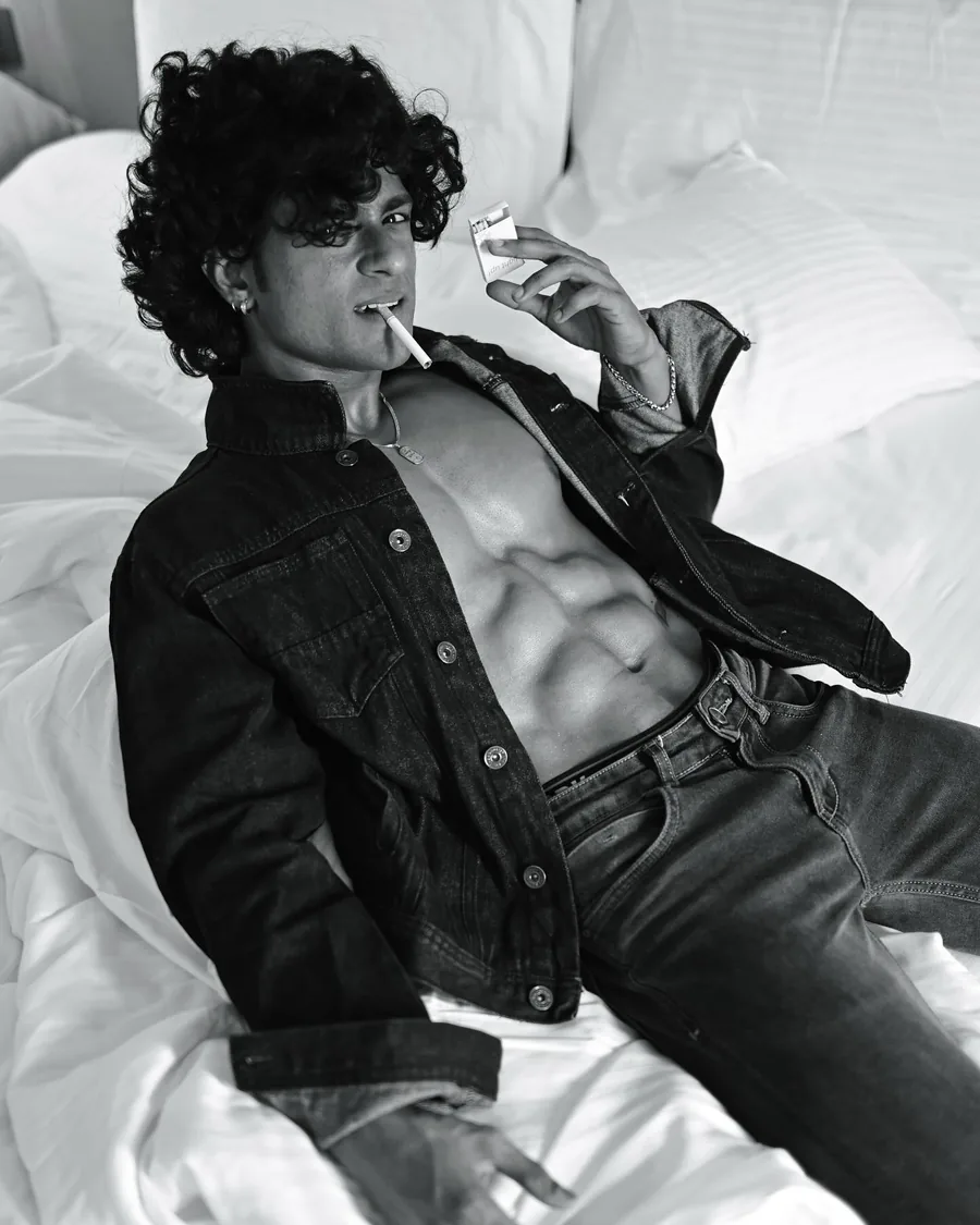 Rajdeep in an open denim jacket, black and white